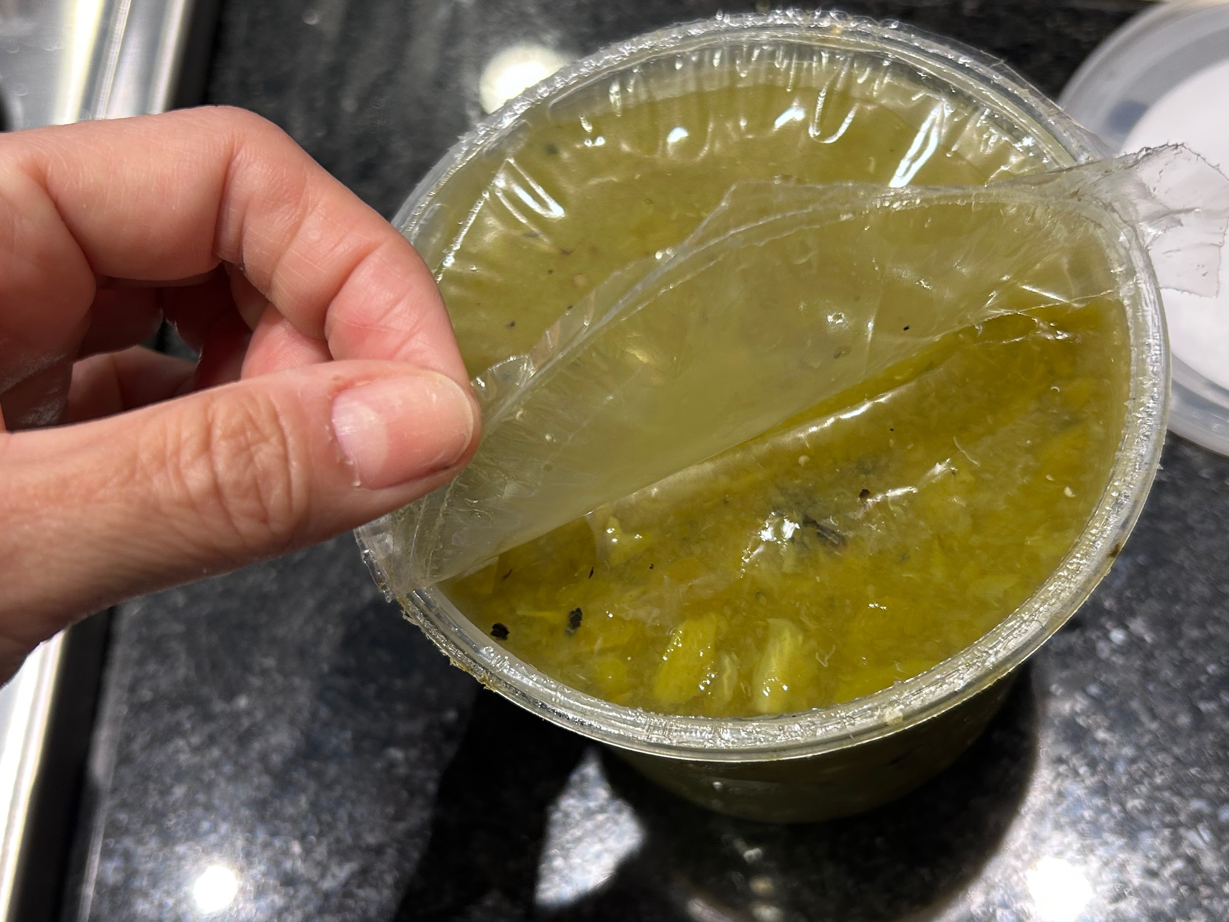 Plastic film under the lid of Del Real red salsa