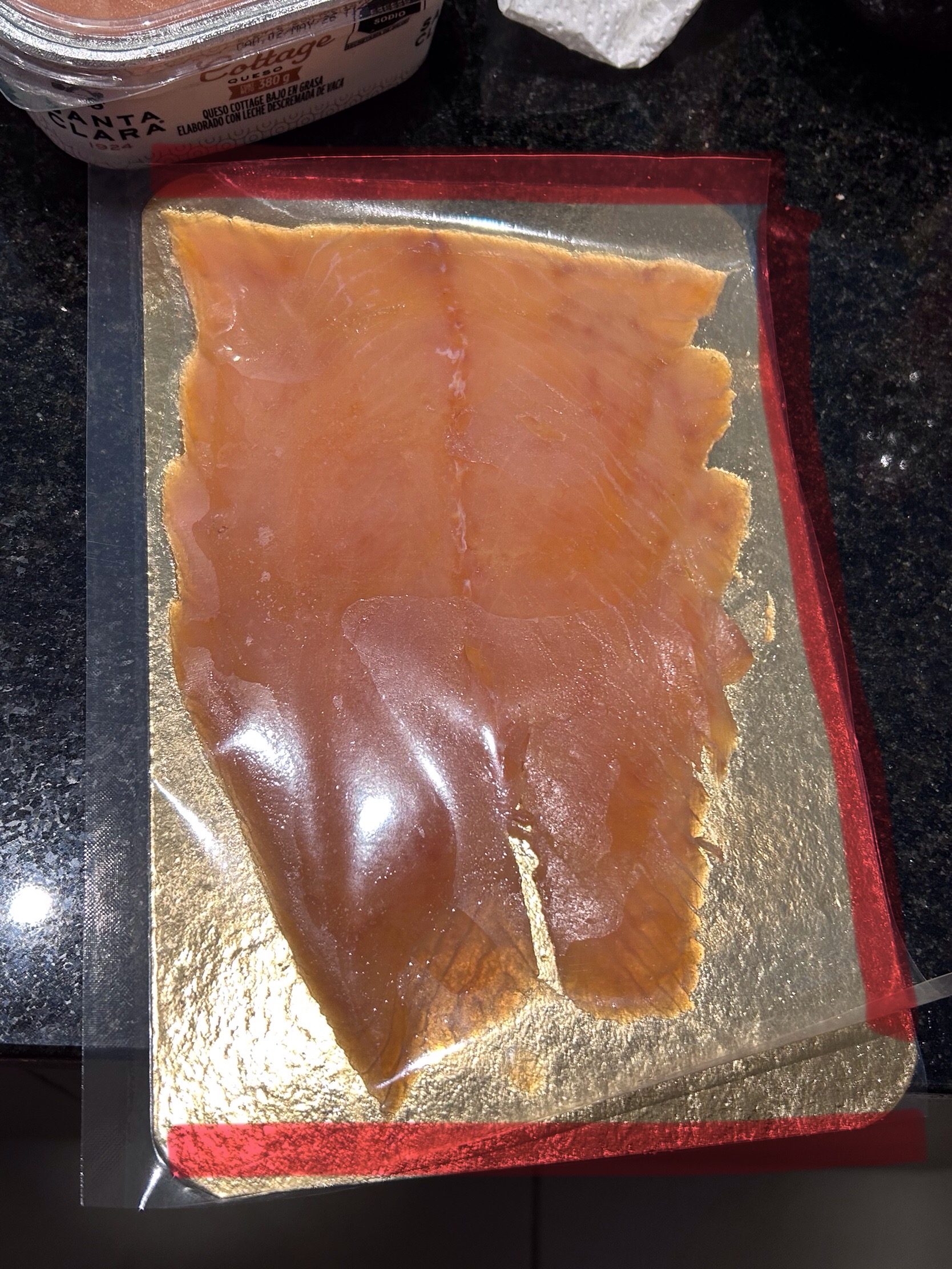 Cutting open a FIORDO smoked salmon pack