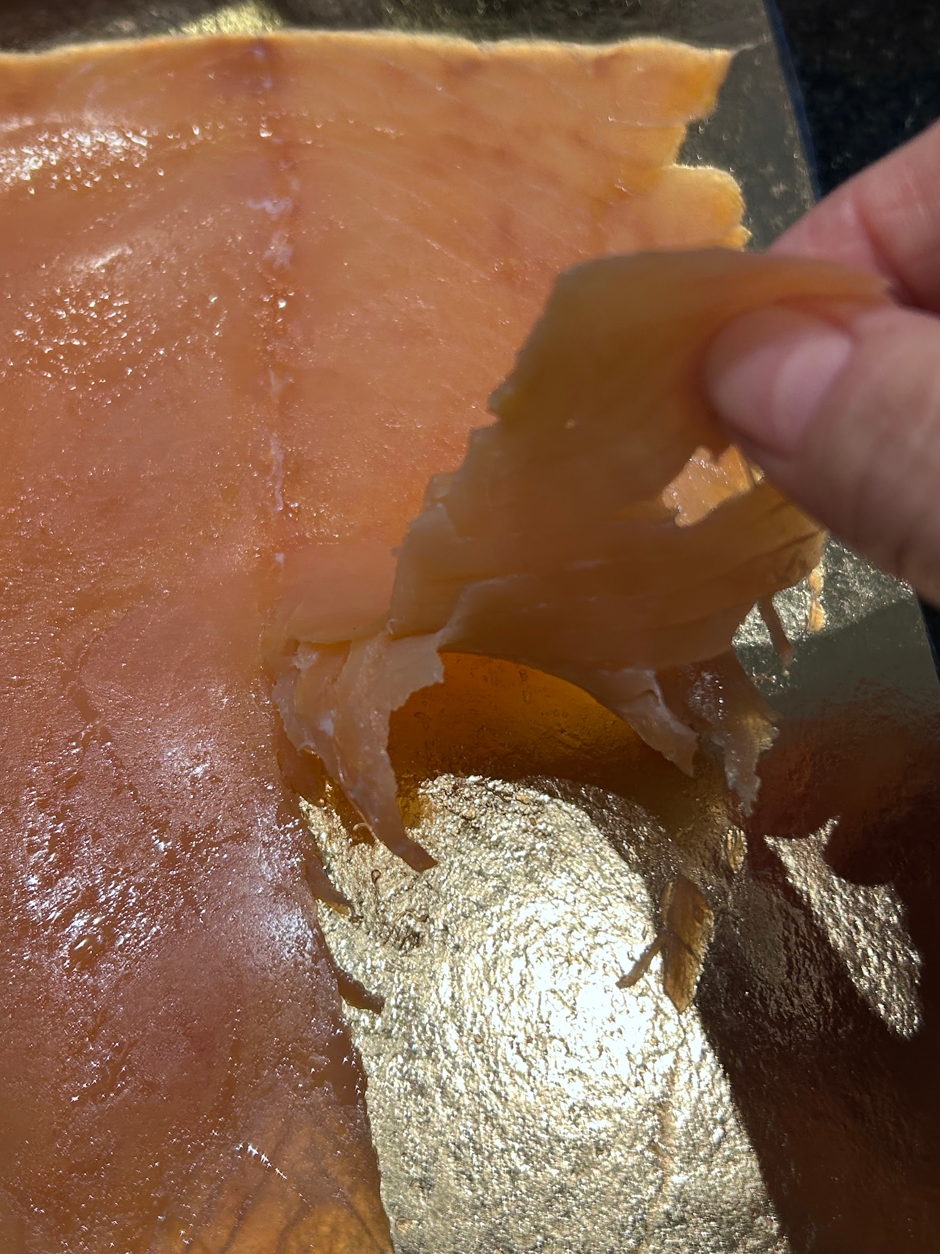 Removing FIORDO smoked salmon from the pack