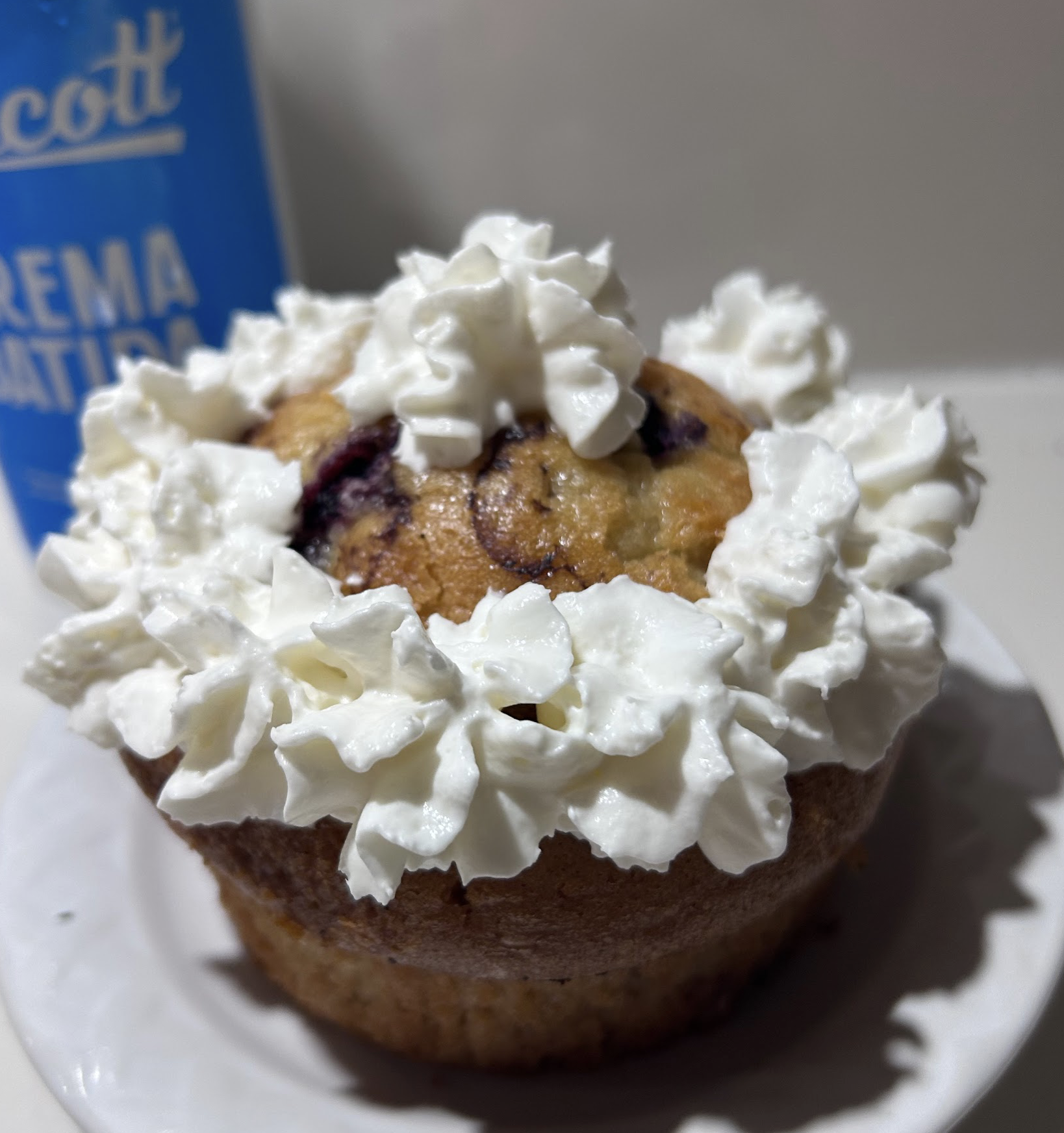 Muffin topped with whipped cream