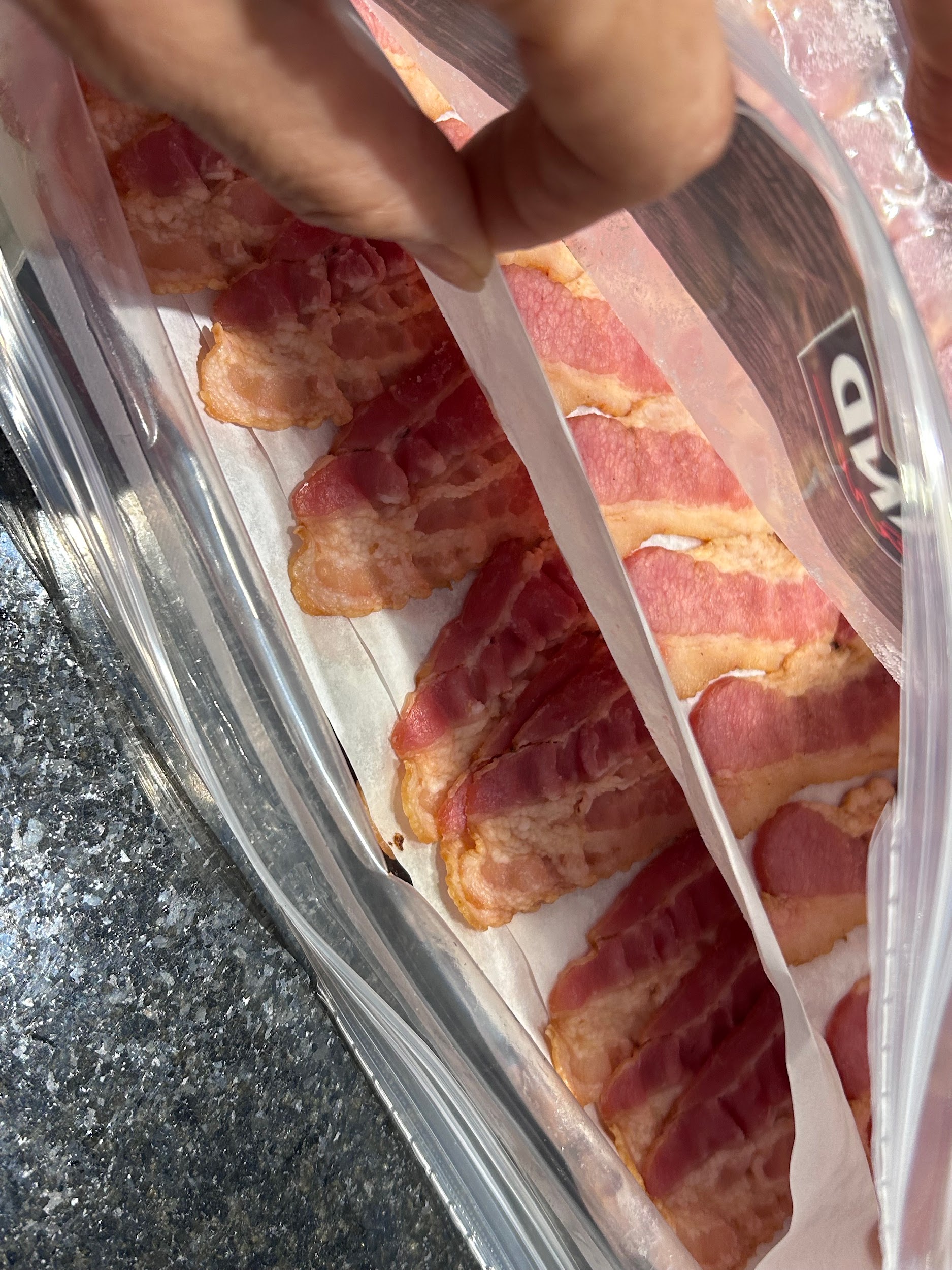 Sheets of Kirkland Signature fully cooked bacon inside the package